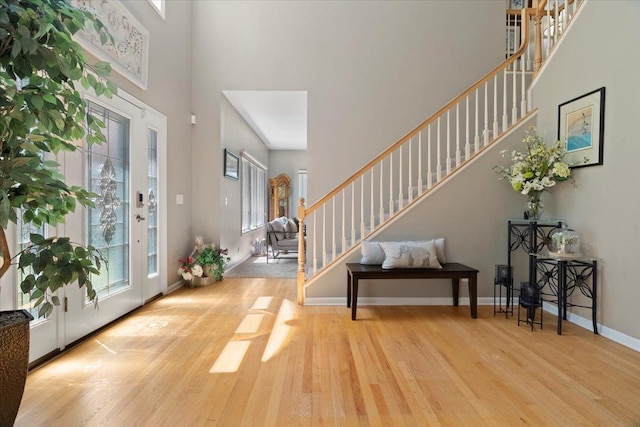 7488 Bittersweet Dr, Gurnee, IL 60031 - entryway with stairs, wood finished floors, and a high ceiling
