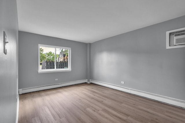 6 E Dundee Quarter Dr Unit 101, Palatine, IL 60074 - empty room featuring baseboard heating, wood finished floors, and a wall mounted AC