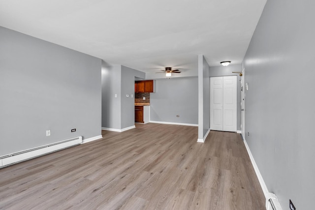 6 E Dundee Quarter Dr Unit 101, Palatine, IL 60074 - unfurnished living room featuring a ceiling fan, light wood finished floors, and a baseboard radiator