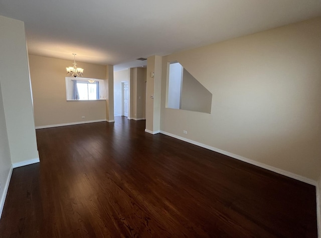 9425 Harrison St Unit 5-714, Des Plaines, IL 60016 - spare room with a chandelier and dark wood finished floors