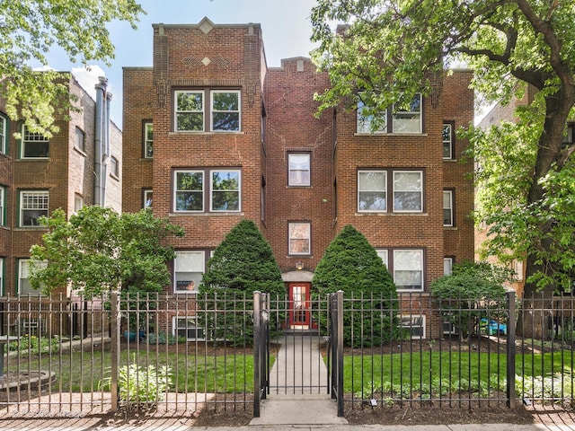 4411 N Beacon St Unit G, Chicago, IL 60640 - view of front facade featuring brick siding and a gate