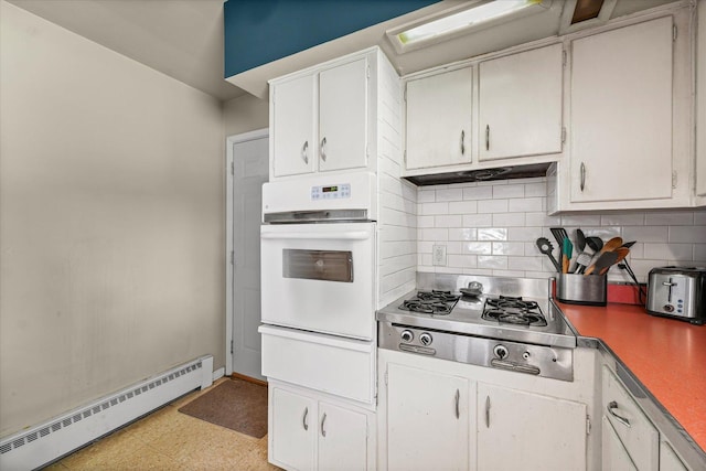 205 Buena Vista Dr, Champaign, IL 61820 - kitchen featuring white oven, a baseboard radiator, stainless steel gas cooktop, a warming drawer, and light flooring