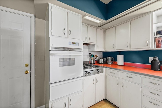 205 Buena Vista Dr, Champaign, IL 61820 - kitchen featuring white oven, stainless steel gas stovetop, a warming drawer, white cabinetry, and light countertops