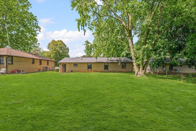 205 Buena Vista Dr, Champaign, IL 61820 - rear view of property with a fenced backyard and brick siding