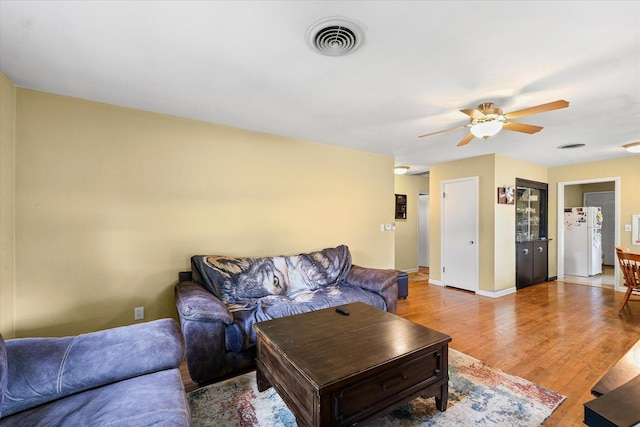 205 Buena Vista Dr, Champaign, IL 61820 - living area with a ceiling fan and light wood-style flooring