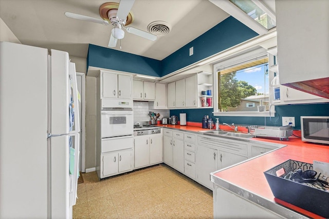 205 Buena Vista Dr, Champaign, IL 61820 - kitchen featuring white appliances, backsplash, ceiling fan, light flooring, and white cabinets
