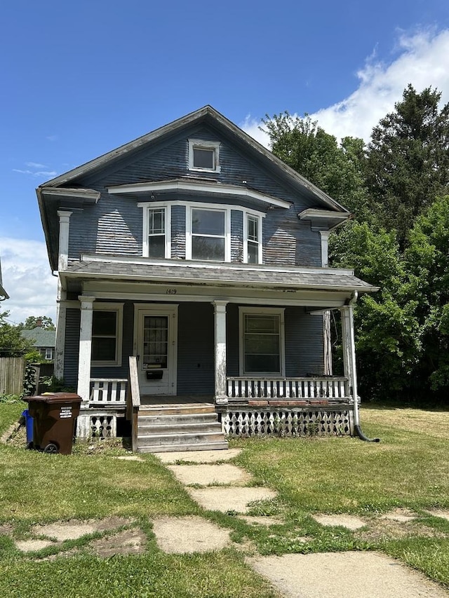 1419 Chestnut St, Rockford, IL 61102 - view of front facade featuring covered porch and a front lawn