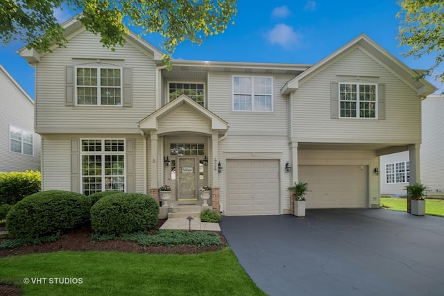 424 Bluegrass Ln, Geneva, IL 60134 - view of front facade with a garage, driveway, and a front yard
