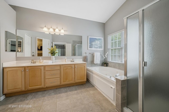 424 Bluegrass Ln, Geneva, IL 60134 - bathroom featuring lofted ceiling, a shower stall, a bath, double vanity, and tile patterned floors