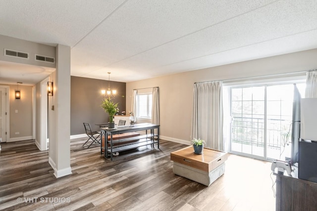59 S Hale St Unit 203, Palatine, IL 60067 - living area with dark wood finished floors, a textured ceiling, and a chandelier