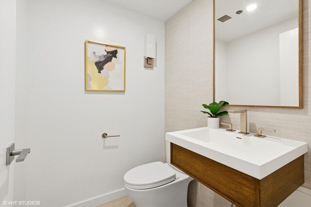 161 E Chicago Ave Unit 27C, Chicago, IL 60611 - bathroom with vanity, tile walls, and tile patterned flooring