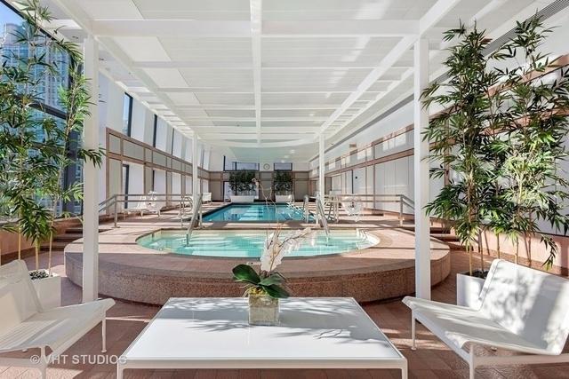 161 E Chicago Ave Unit 27C, Chicago, IL 60611 - indoor community pool featuring a hot tub and a patio area