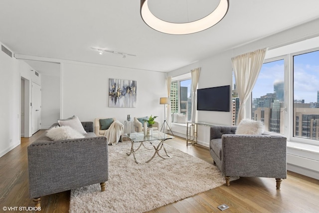 161 E Chicago Ave Unit 27C, Chicago, IL 60611 - living room with track lighting and wood finished floors