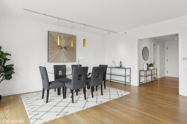 161 E Chicago Ave Unit 27C, Chicago, IL 60611 - dining space with wood finished floors and track lighting