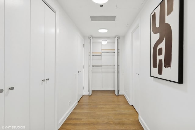 161 E Chicago Ave Unit 27C, Chicago, IL 60611 - hallway with light wood-style flooring and baseboards