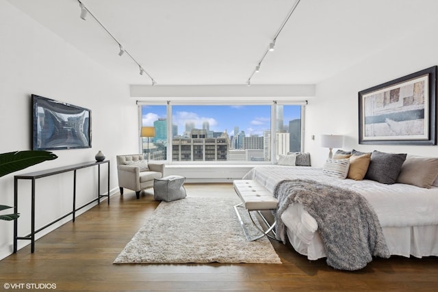 161 E Chicago Ave Unit 27C, Chicago, IL 60611 - bedroom with track lighting, wood finished floors, and a view of skyline