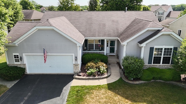 424 Riverbend Dr, Genoa, IL 60135 - ranch-style house with stone siding, asphalt driveway, an attached garage, a porch, and a shingled roof
