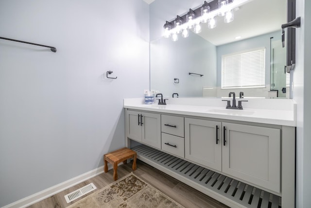 424 Riverbend Dr, Genoa, IL 60135 - bathroom with double vanity and wood finished floors