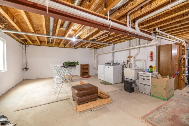 424 Riverbend Dr, Genoa, IL 60135 - basement with washing machine and dryer and a sink