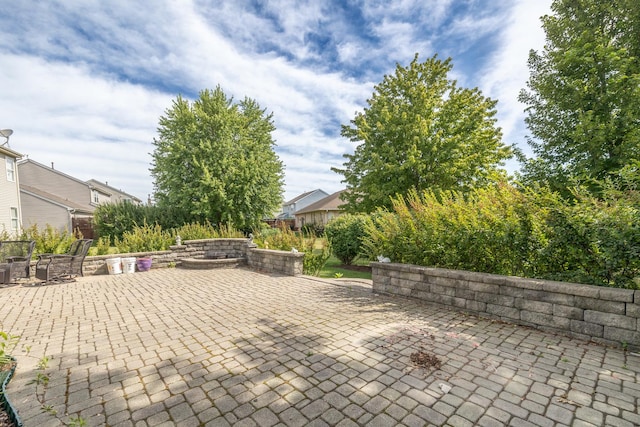 424 Riverbend Dr, Genoa, IL 60135 - view of patio / terrace featuring a fire pit