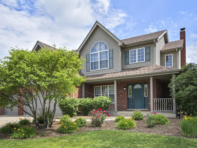 16107 Carlow Cir, Manhattan, IL 60442 - view of front of house with covered porch, a chimney, brick siding, and a shingled roof