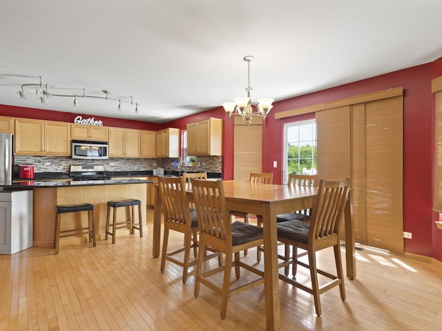 16107 Carlow Cir, Manhattan, IL 60442 - dining area with light wood-style floors and a chandelier