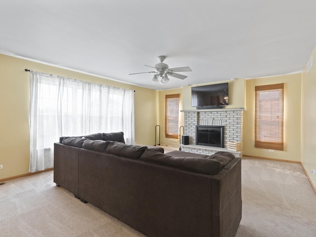 16107 Carlow Cir, Manhattan, IL 60442 - living room with light colored carpet, a ceiling fan, and a fireplace