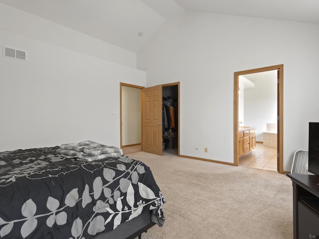 16107 Carlow Cir, Manhattan, IL 60442 - bedroom with light colored carpet, high vaulted ceiling, a walk in closet, connected bathroom, and a closet