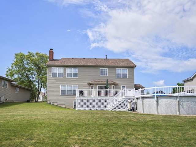 16107 Carlow Cir, Manhattan, IL 60442 - back of property featuring a chimney, a wooden deck, a yard, and an outdoor pool