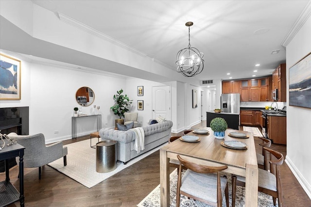 506 W Oakdale Ave Unit 1, Chicago, IL 60657 - dining area with a chandelier, dark wood-style floors, crown molding, and recessed lighting