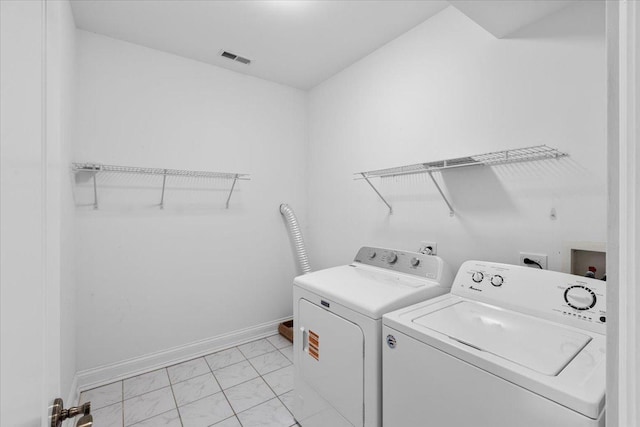 506 W Oakdale Ave Unit 1, Chicago, IL 60657 - laundry room featuring light marble finish floors and washer and dryer