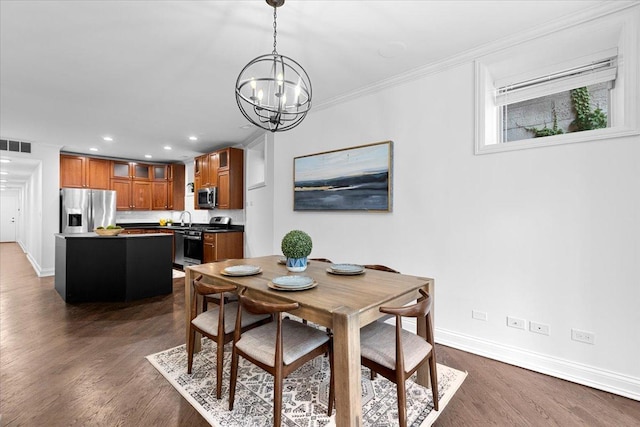 506 W Oakdale Ave Unit 1, Chicago, IL 60657 - dining area with a chandelier, dark wood-style floors, ornamental molding, and recessed lighting