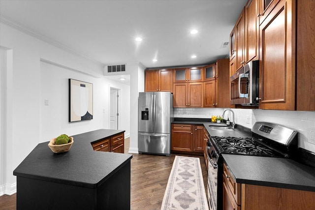 506 W Oakdale Ave Unit 1, Chicago, IL 60657 - kitchen featuring appliances with stainless steel finishes, dark countertops, brown cabinets, ornamental molding, and tasteful backsplash