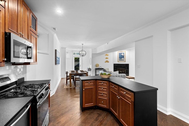 506 W Oakdale Ave Unit 1, Chicago, IL 60657 - kitchen featuring appliances with stainless steel finishes, dark countertops, dark wood finished floors, glass insert cabinets, and crown molding