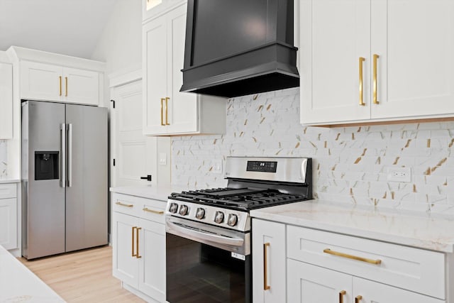 8545 Mansfield Ave, Burbank, IL 60459 - kitchen with stainless steel appliances, custom exhaust hood, white cabinetry, light stone countertops, and tasteful backsplash