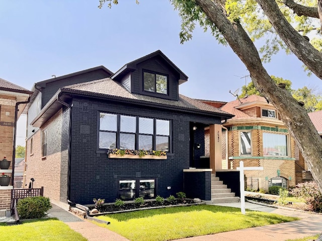 2640 N 76th Ct, Elmwood Park, IL 60707 - view of front facade featuring brick siding and a front yard