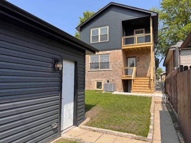 2640 N 76th Ct, Elmwood Park, IL 60707 - rear view of property featuring a balcony and brick siding
