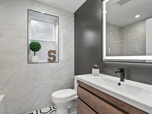 2640 N 76th Ct, Elmwood Park, IL 60707 - bathroom with vanity and tile walls