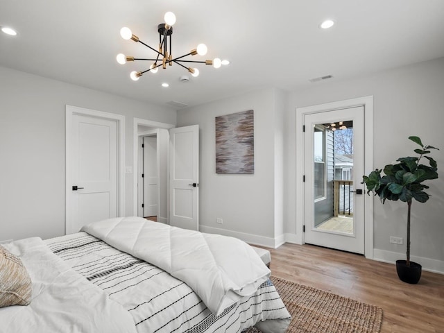 2640 N 76th Ct, Elmwood Park, IL 60707 - bedroom featuring a chandelier, access to outside, light wood-type flooring, and recessed lighting