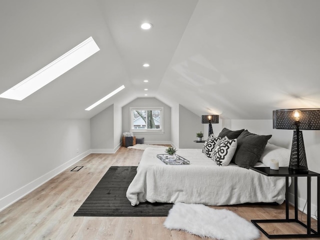 2640 N 76th Ct, Elmwood Park, IL 60707 - bedroom with a skylight, lofted ceiling, wood finished floors, and recessed lighting