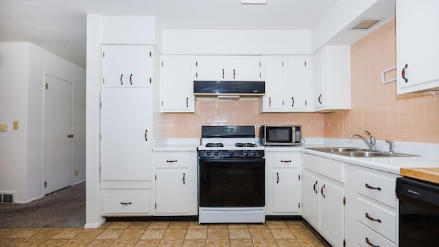 17 Kingswood Dr, Normal, IL 61761 - kitchen featuring range with gas cooktop, stainless steel microwave, under cabinet range hood, black dishwasher, and light countertops