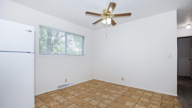 17 Kingswood Dr, Normal, IL 61761 - empty room with a ceiling fan and light stone finish floors