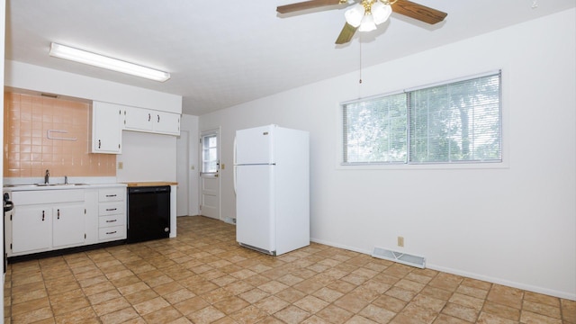 17 Kingswood Dr, Normal, IL 61761 - kitchen featuring freestanding refrigerator, dishwasher, light countertops, a ceiling fan, and tasteful backsplash
