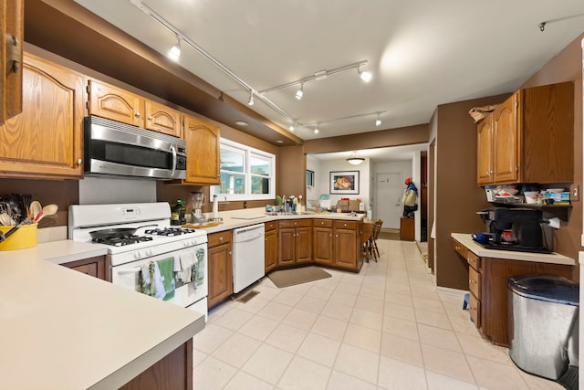 436 Cambridge Way, Bolingbrook, IL 60440 - kitchen featuring white appliances, rail lighting, a peninsula, and light countertops