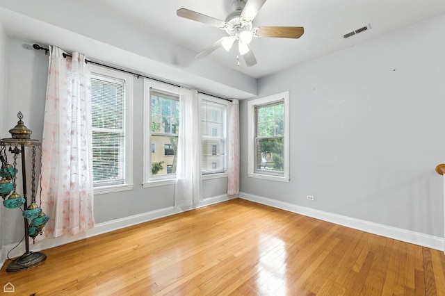 2611 W Rosemont Ave Unit A, Chicago, IL 60659 - spare room with light wood-style floors and a ceiling fan