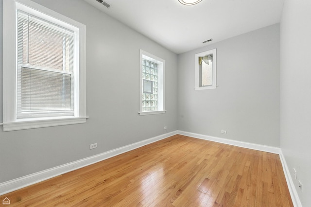 2611 W Rosemont Ave Unit A, Chicago, IL 60659 - unfurnished room featuring light wood finished floors and baseboards