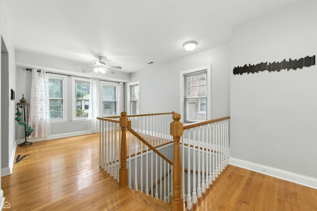 2611 W Rosemont Ave Unit A, Chicago, IL 60659 - hallway featuring an upstairs landing, healthy amount of natural light, and light wood-style flooring