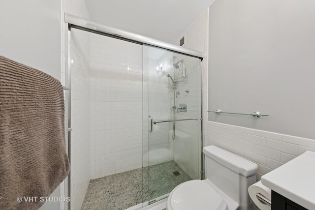 1325 N State Pkwy Unit 6D, Chicago, IL 60610 - full bathroom with a shower stall, vanity, tile walls, and a wainscoted wall