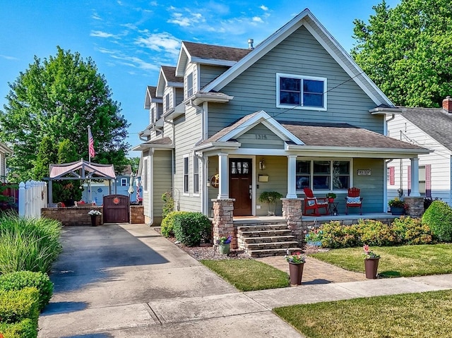 1315 W Jackson St, Ottawa, IL 61350 - view of front of property with a gate, covered porch, driveway, and a shingled roof
