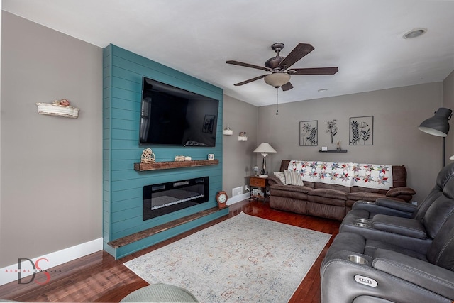 1315 W Jackson St, Ottawa, IL 61350 - living area featuring dark wood-type flooring, a ceiling fan, and a fireplace